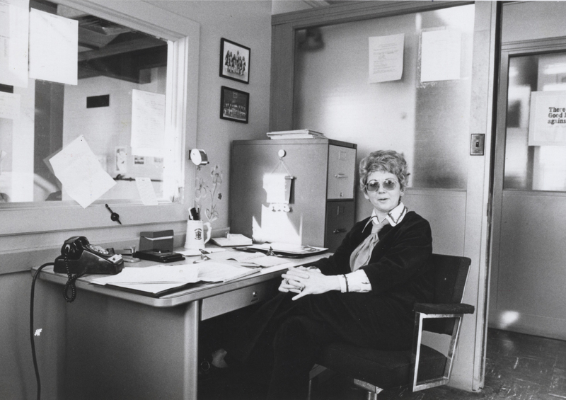 Helen Bert sits at a desk in an office.