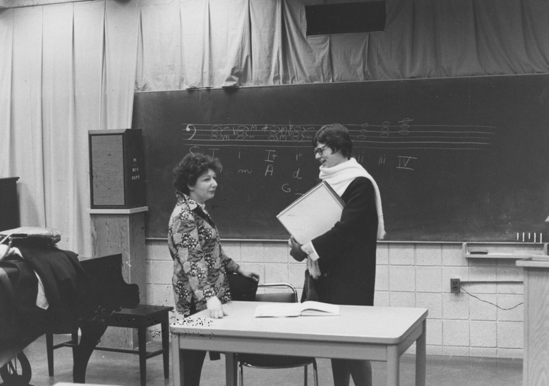 Marilyn Currier stands in a music room with Sister Gail Himrod.