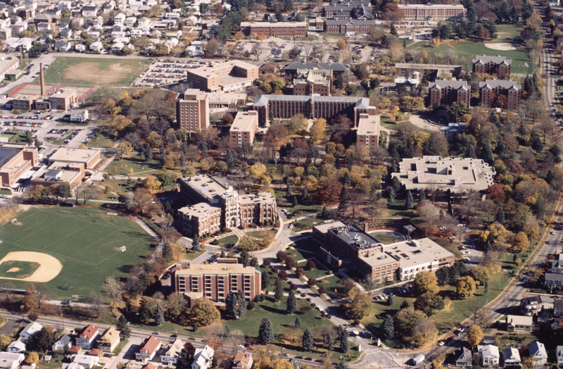 Aerial view of Providence College with academic buildings, dormitories, sports fields, and surrounding residential neighborhoods.