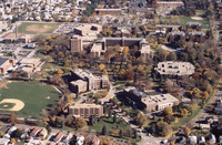 Aerial view of Providence College with academic buildings, dormitories, sports fields, and surrounding residential neighborhoods.
